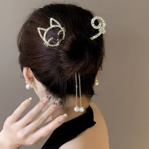 Rhinestone hairpin pearl bun artifact